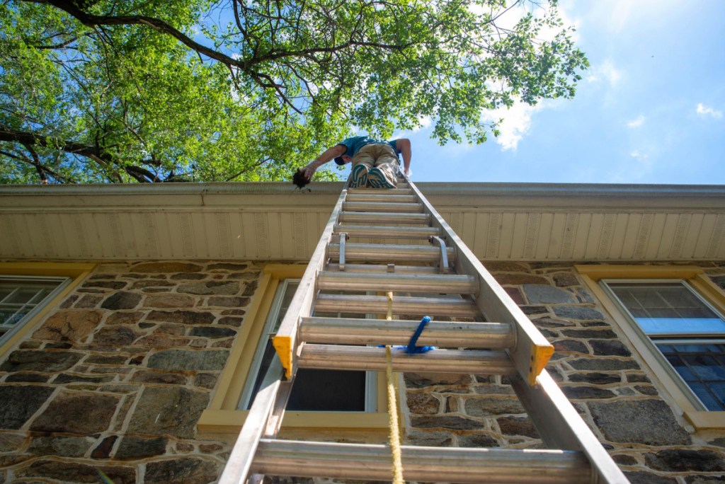 A ladder on the side of a home.