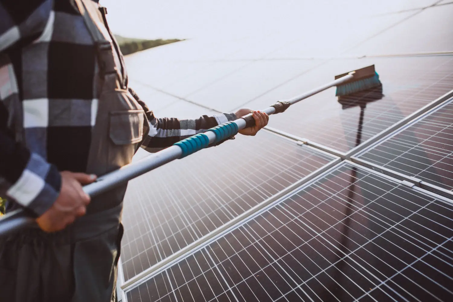 Cleaning solar panels out on a solar farm.